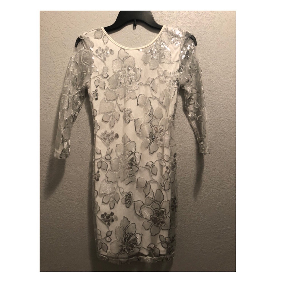 Low back white bodycon dress with floral detail
